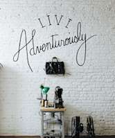 a white brick wall with the words live accountability on it