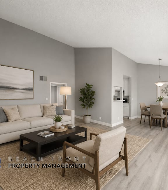 A well-lit, modern kitchen and living room with a dining area.