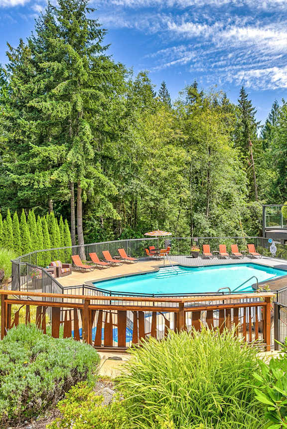 A large outdoor kitchen with a grill and sink. at Lakemont Orchard Apartments, Washington