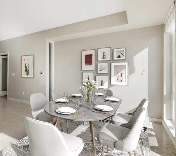 a dining room with a table and chairs