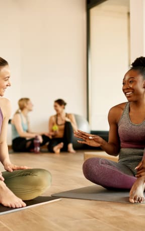 group of 4 woman during yoga class