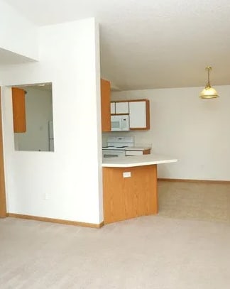 A room with a desk and a cabinet.