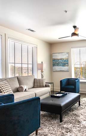 a living room and dining room with a couch and a table