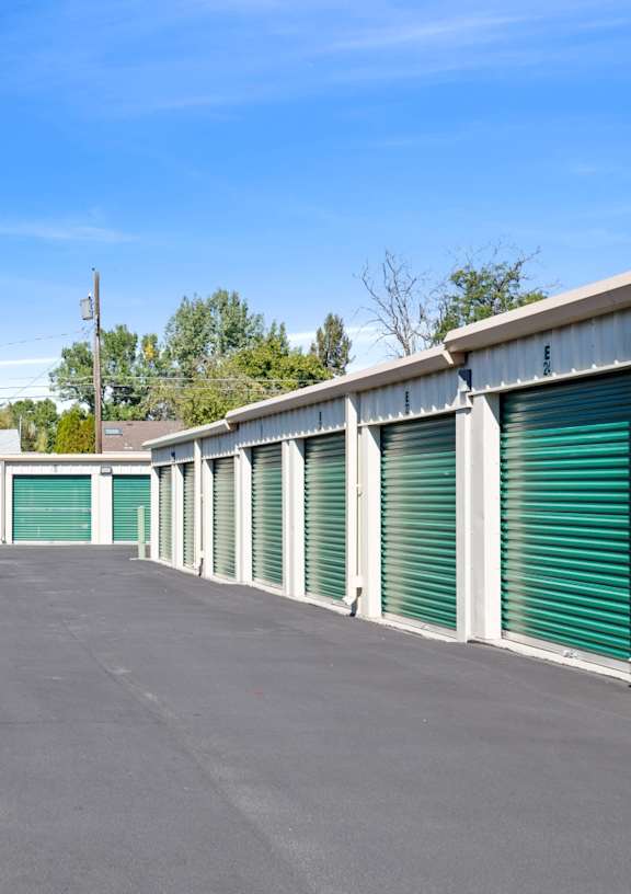 A long row of green storage units with the number 28 visible on the top right.