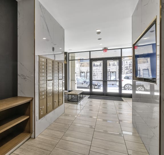 a hallway with a desk and a door to a building  at Nineteen North, Buffalo, New York 14202