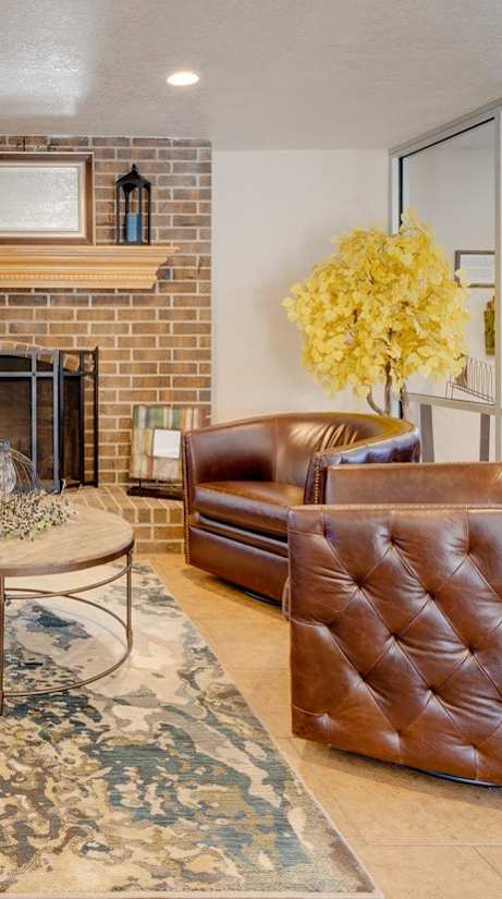 A classic living room in the clubhouse interior, featuring timeless furniture, comfortable seating arrangements, and tasteful decor, provides a welcoming and cozy communal space for residents to relax and socialize.