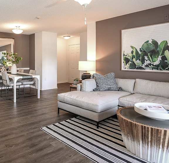 a bedroom with a bed and a ceiling fan
