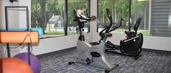 a room filled with lots of different types of exercise equipment