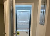 Thumbnail 16 of 19 - A microwave is placed on a countertop in a kitchen.
