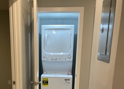 A microwave is placed on a countertop in a kitchen.