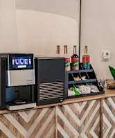 a table with a coffee maker at vantage apartments clubhouse