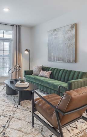a living room and dining room with a couch and a table