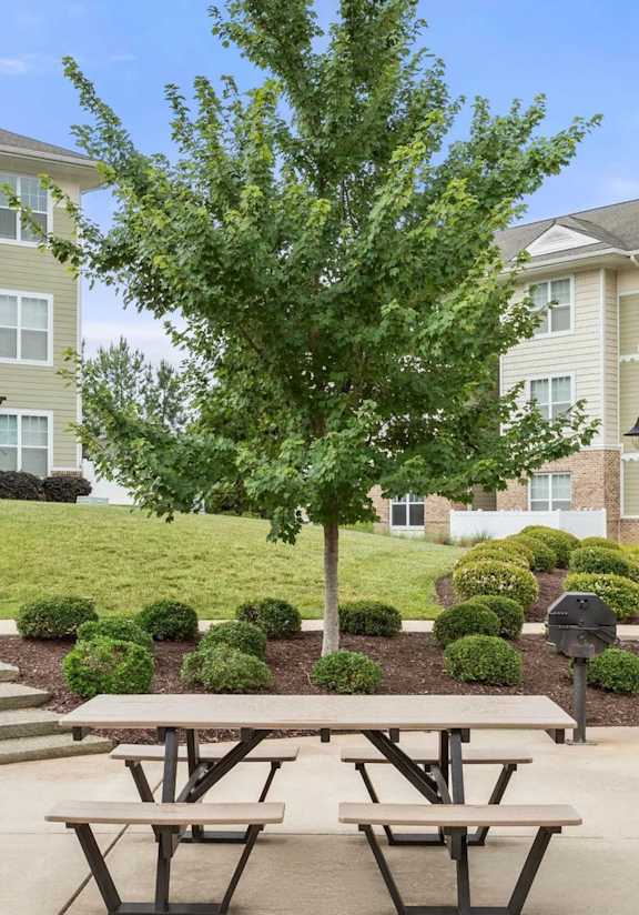 A bocce ball court in front of apartment buildings.