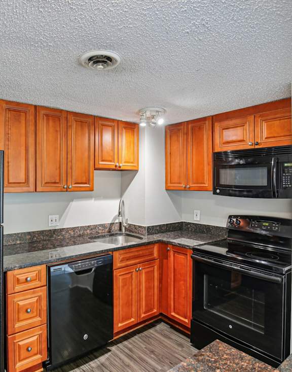 Kitchen with Brown Cabinets at Vista Condominiums, Kansas