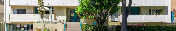 a picture of an apartment building on a sunny day