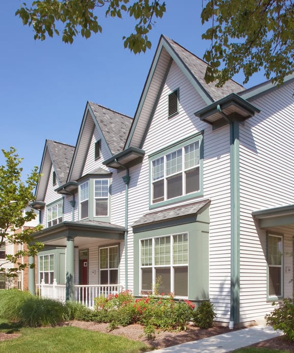 a row of townhouses on the side of a street at Fairfield apartments and townhomes in Pittsburgh, PA