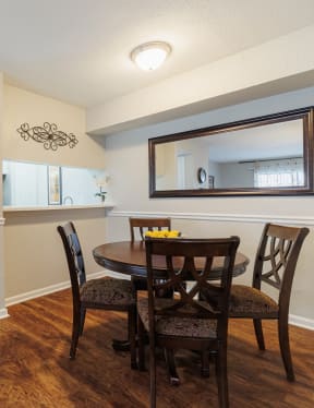 a kitchen with white cabinets and black appliances