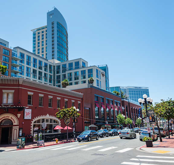 A city street with cars and buildings.
