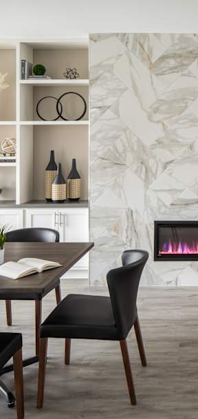 A modern dining room with a table set for four.