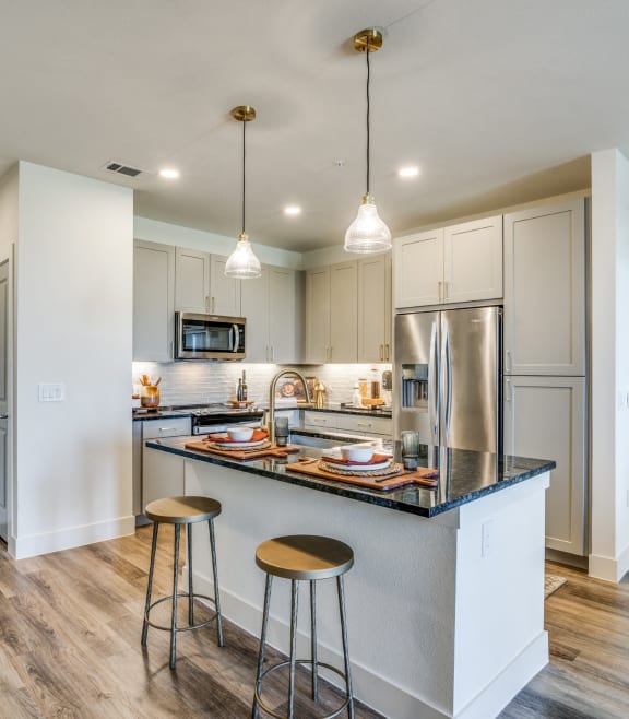 Aura Avant Apartments in Lewisville, Texas Model Kitchen with Island