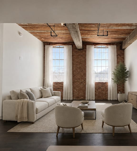 a bedroom with a brick wall and a window  at The Mill at Prattville, Alabama