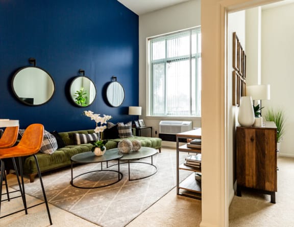 a living room with a blue accent wall at Shearwood Station, New York