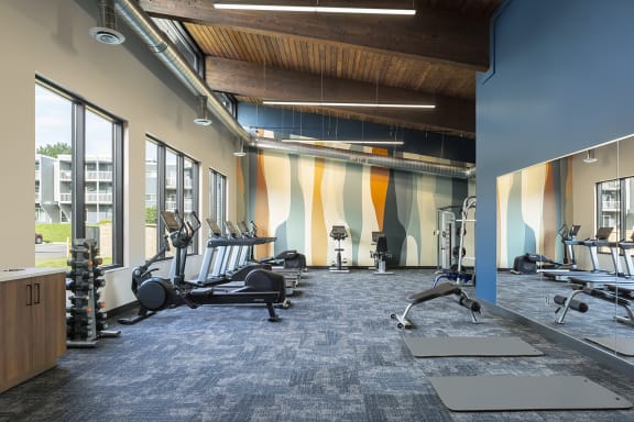 people running on a treadmill in a gym at The Bosk Apartment Homes, Woodbury, MN, 55125