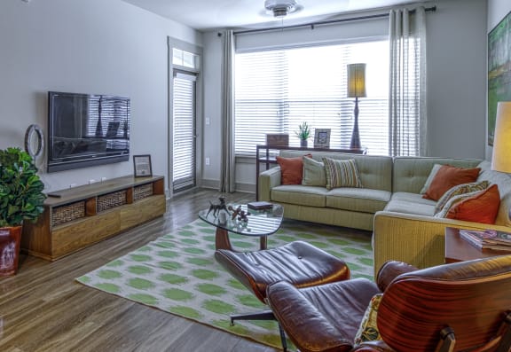 Living Room with Private Patio Access at 4700 Colonnade Apartments in Birmingham, AL