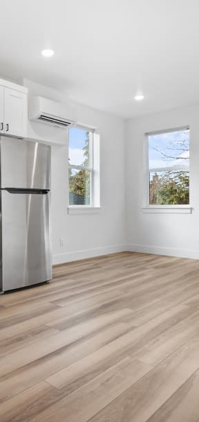 a kitchen and living room with a table