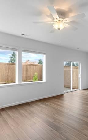 a bedroom with a large window and a closet