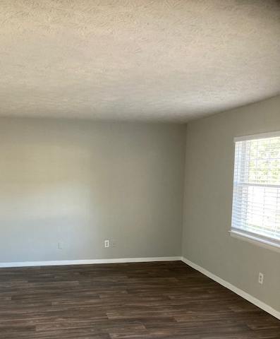 an empty room with a skylight