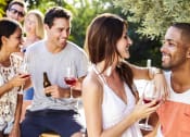 Thumbnail 13 of 24 - Residents enjoying a community social gathering outdoors