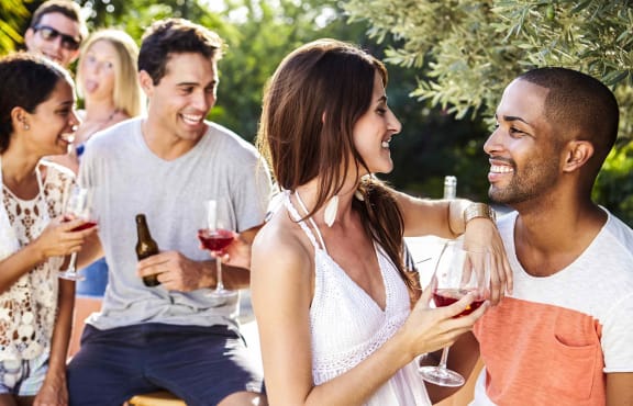 Residents enjoying a community social gathering outdoors