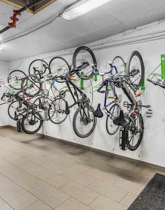 a room with several bikes hanging on the wall at Wilmington Flats Apartments, Salt Lake City, UT, 84106