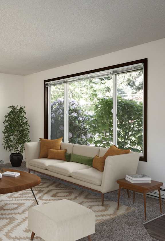 a living room with a white couch and a large window