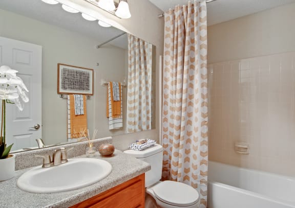 Model Bathroom with Ceramic Tile in Tubs and Showers at Apartments for Rent Near Atlanta, GA