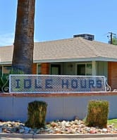 a house with two palm trees in front of it