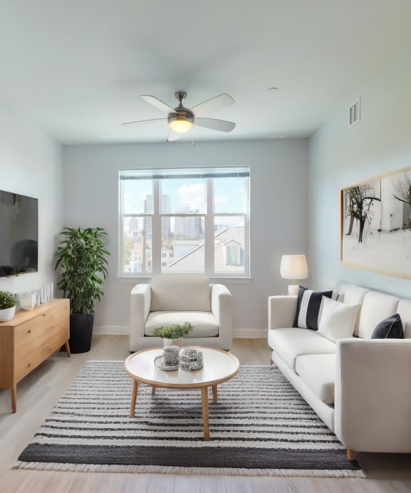 a living room with a white couch and a coffee table