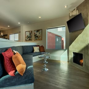 resident loung with a couch and a fireplace