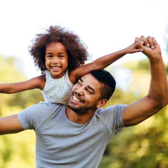 father and daughter playing outside at Pointe East, Fife, WA, 98424