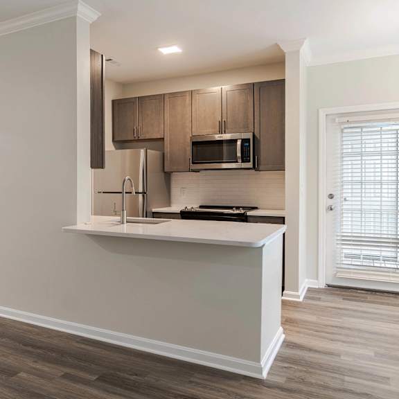 a kitchen with a counter top and a microwave