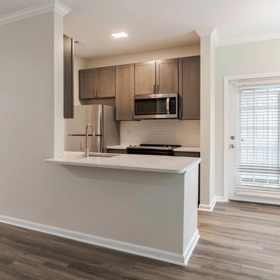 a kitchen with a counter top and a microwave