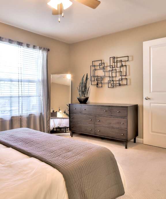 Bedroom with neutral decor at Rosemeade Apartments, Roseville, CA 95661