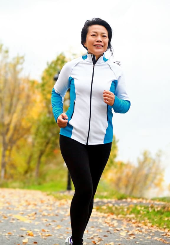 Woman Running Outdoors at Fountain Glen Grand Isle