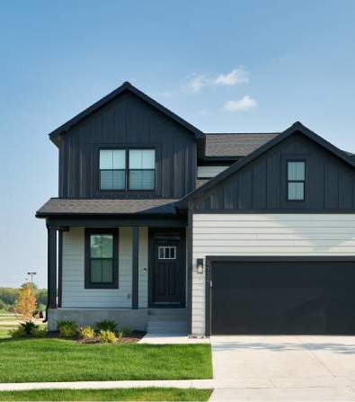 a black and white house with a garage door