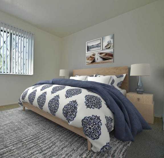 a bedroom with a bed and a ceiling fan at Woodland Place Apartments, Michigan, 48640