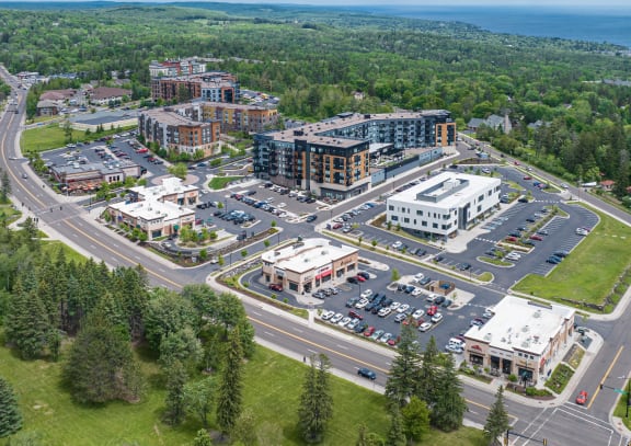 an aerial view of a city with buildings and a road