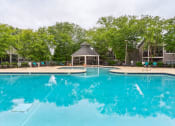 Thumbnail 13 of 14 - a large swimming pool with a gazebo and a resort style hotel pool  at Harrison Grande, Cary, NC, 27513