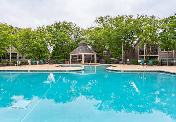 a large swimming pool with a gazebo and a resort style hotel pool  at Harrison Grande, Cary, NC, 27513