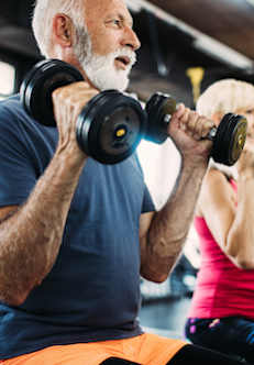Two people lifting dumbbells